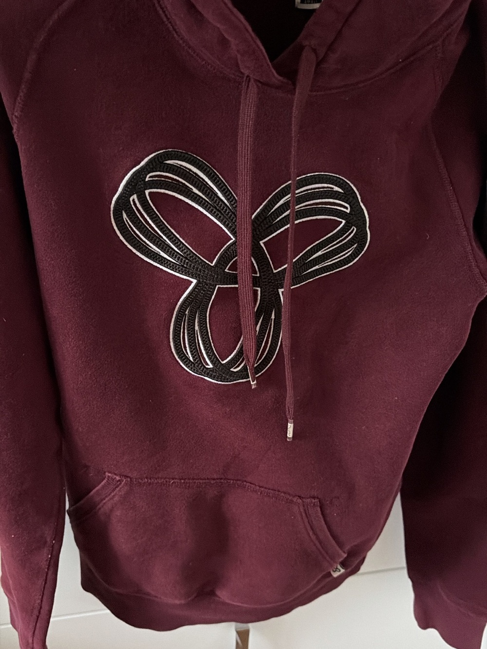 TNA Women's Burgundy Pullover Hoodie with Black Appliqué ptp 19